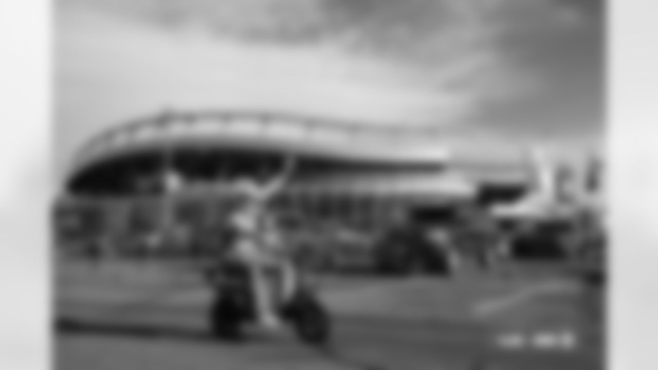 A fan rides a motorized bike before the Broncos' Week 18 game against the Los Angeles Chargers at Empower Field at Mile High in Denver, Colorado on January 4, 2026. Photo by Ben Swanson / Denver Broncos