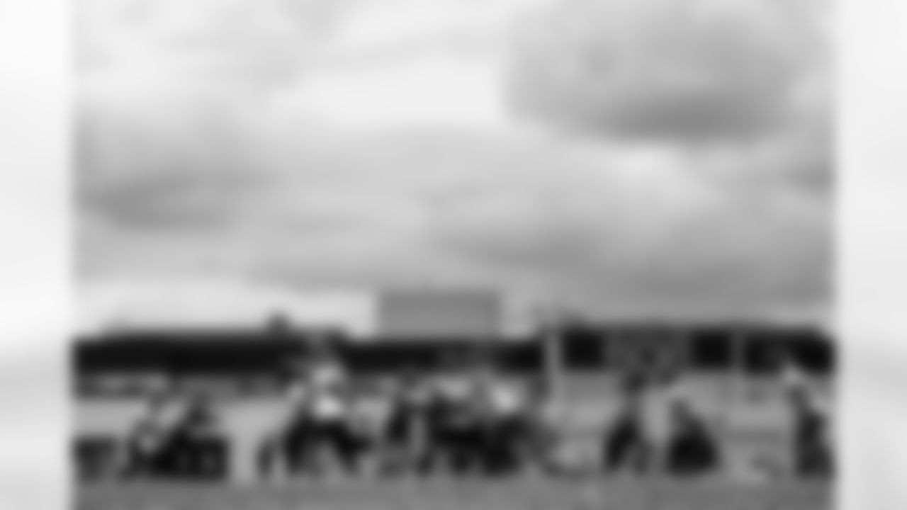 A slow-shutter image of a play during an OTA practice at Broncos Park Powered by CommonSpirit in Englewood, Colorado on May 29, 2025. Photo by Ben Swanson / Denver Broncos