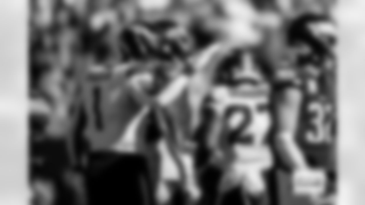 Denver Broncos tight end Evan Engram (1) congratulates running back J.K. Dobbins (27) after his touchdown during the Broncos' Week 5 game against the Philadelphia Eagles at Lincoln Financial Field in Philadelphia, Pennsylvania on October 5, 2025. Photo by Ben Swanson / Denver Broncos