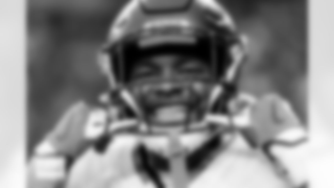 Denver Broncos cornerback Ja'Quan McMillian (29) smiles, displaying his grill, before the Broncos' Week 14 game against the Las Vegas Raiders at Allegiant Stadium in Las Vegas, Nevada on December 7, 2025. Photo by Ben Swanson / Denver Broncos