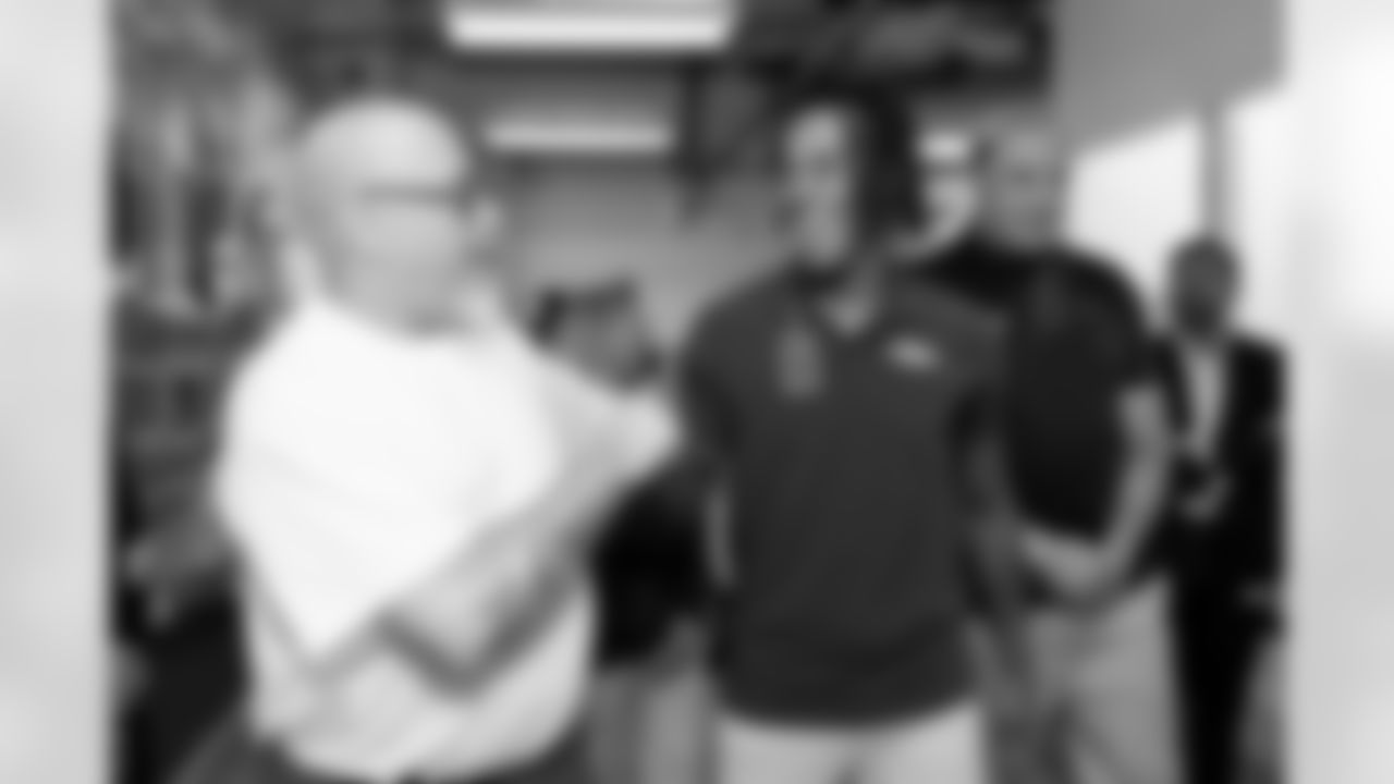 An inmate talks about his artwork with Pat Bryant and Garett Bolles during a visit to the Arkansas Valley Correctional Facility in Ordway, Colorado on October 14, 2025. In partnership with the Vera Institute of Justice, the Denver Broncos Foundation toured ChangeMakers Village (a Restoring Promise Unit).Photo by Gabriel Christus / Denver Broncos