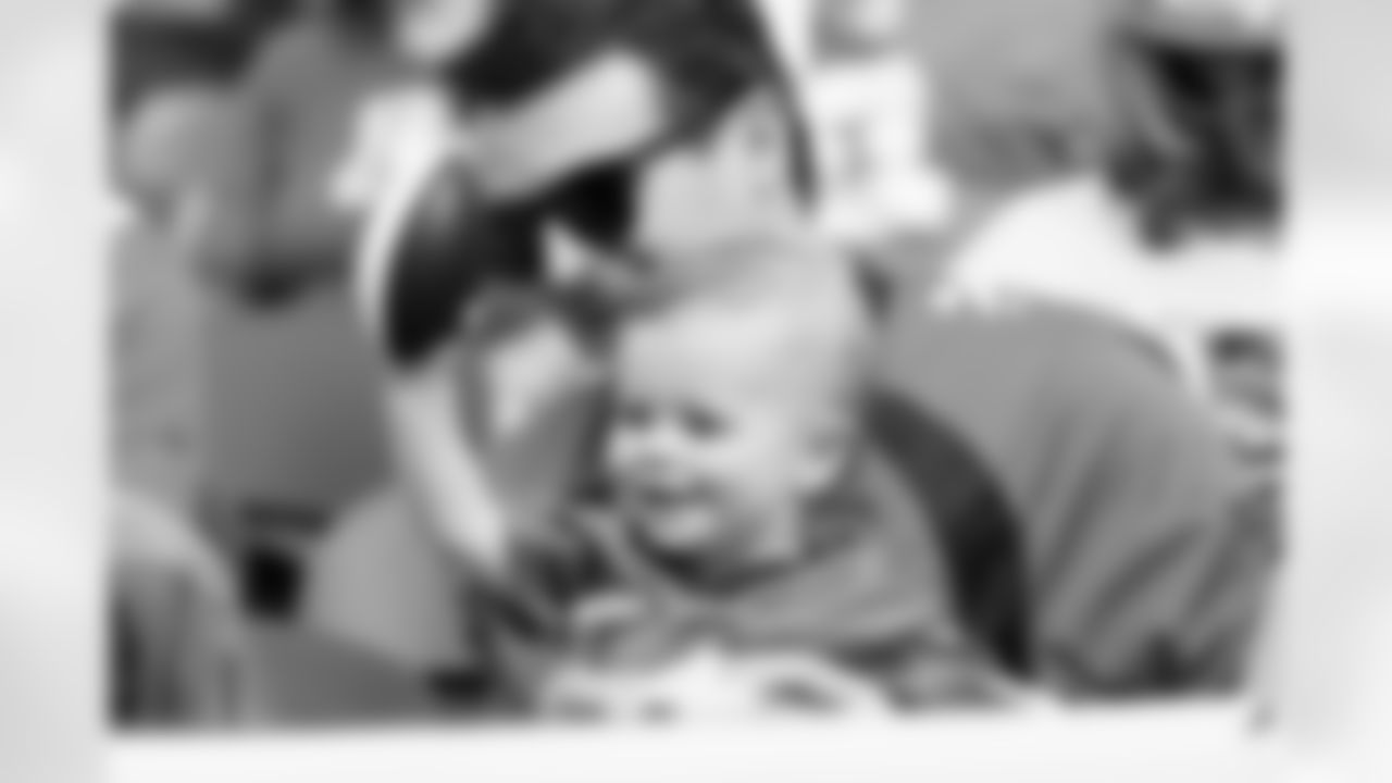 A young fan plays with a foam football during the Broncos' Week 1 game against the Tennessee Titans at Empower Field at Mile High in Denver, Colorado on September 7, 2025. Photo by Gavin Liddell / Denver Broncos