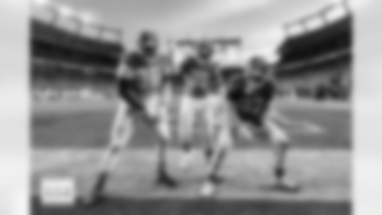 Eyioma Uwazurike, Sai'vion Jones and Malcolm Roach celebrate during the Broncos' Week 18 game against the Los Angeles Chargers at Empower Field at Mile High in Denver, Colorado on January 4, 2026. Photo by Ben Swanson / Denver Broncos