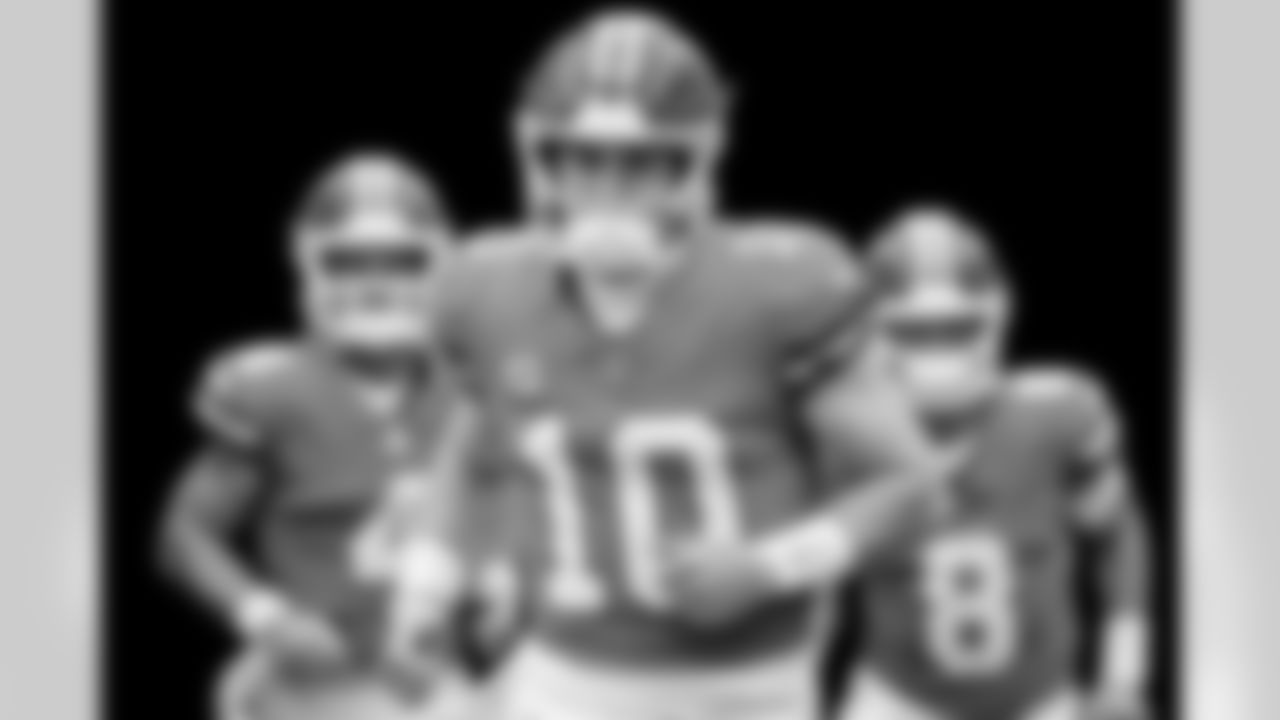 Denver Broncos quarterback Bo Nix (10) leads the quarterbacks onto the field before the Broncos' Week 8 game against the Dallas Cowboys at Empower Field at Mile High in Denver, Colorado on October 26, 2025. Photo by Ben Swanson / Denver Broncos