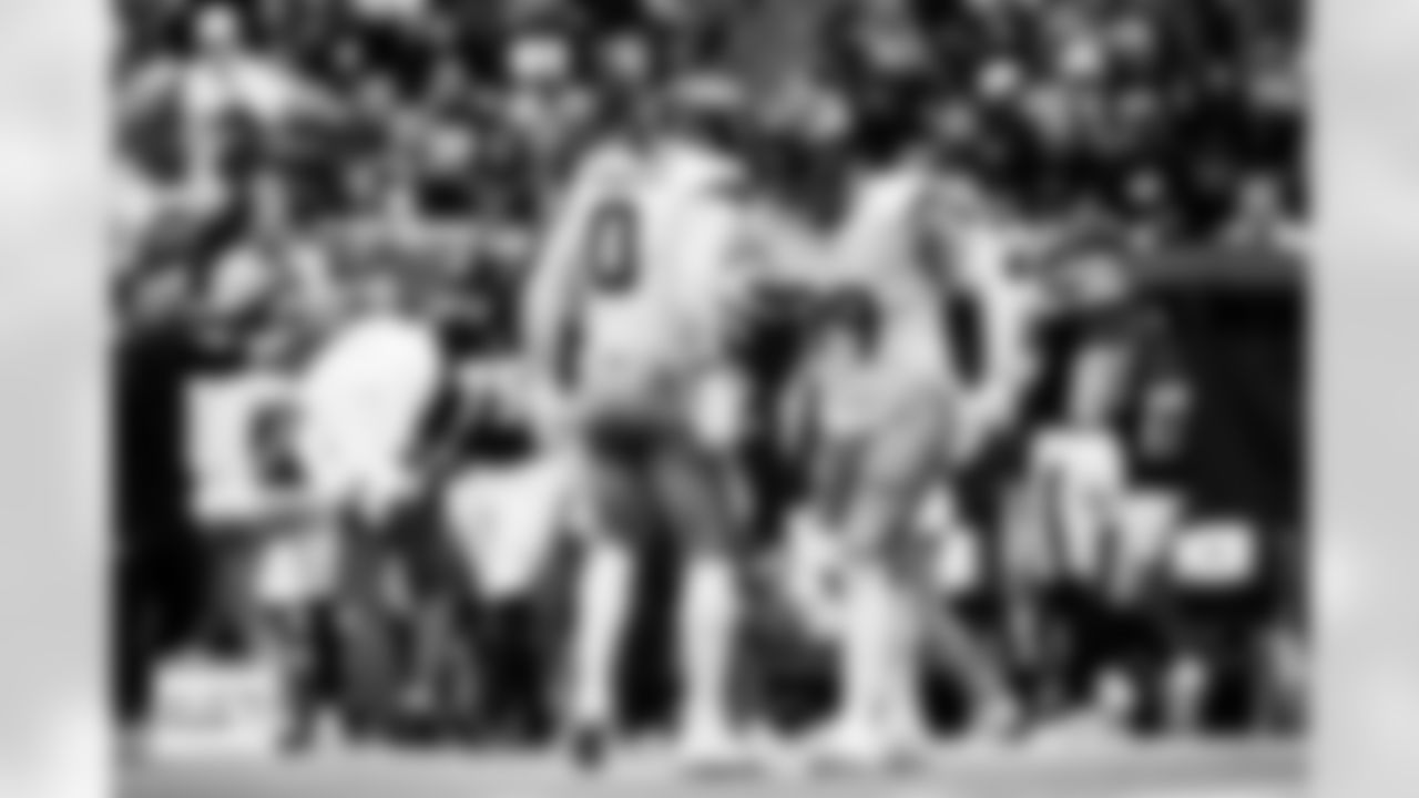 Denver Broncos defensive end Zach Allen (99) and linebacker Jonathon Cooper (0) celebrate after a play during the Broncos' Week 9 game against the Houston Texans at NRG Stadium in Houston, Texas on November 2, 2025. Photo by Gabriel Christus / Denver Broncos