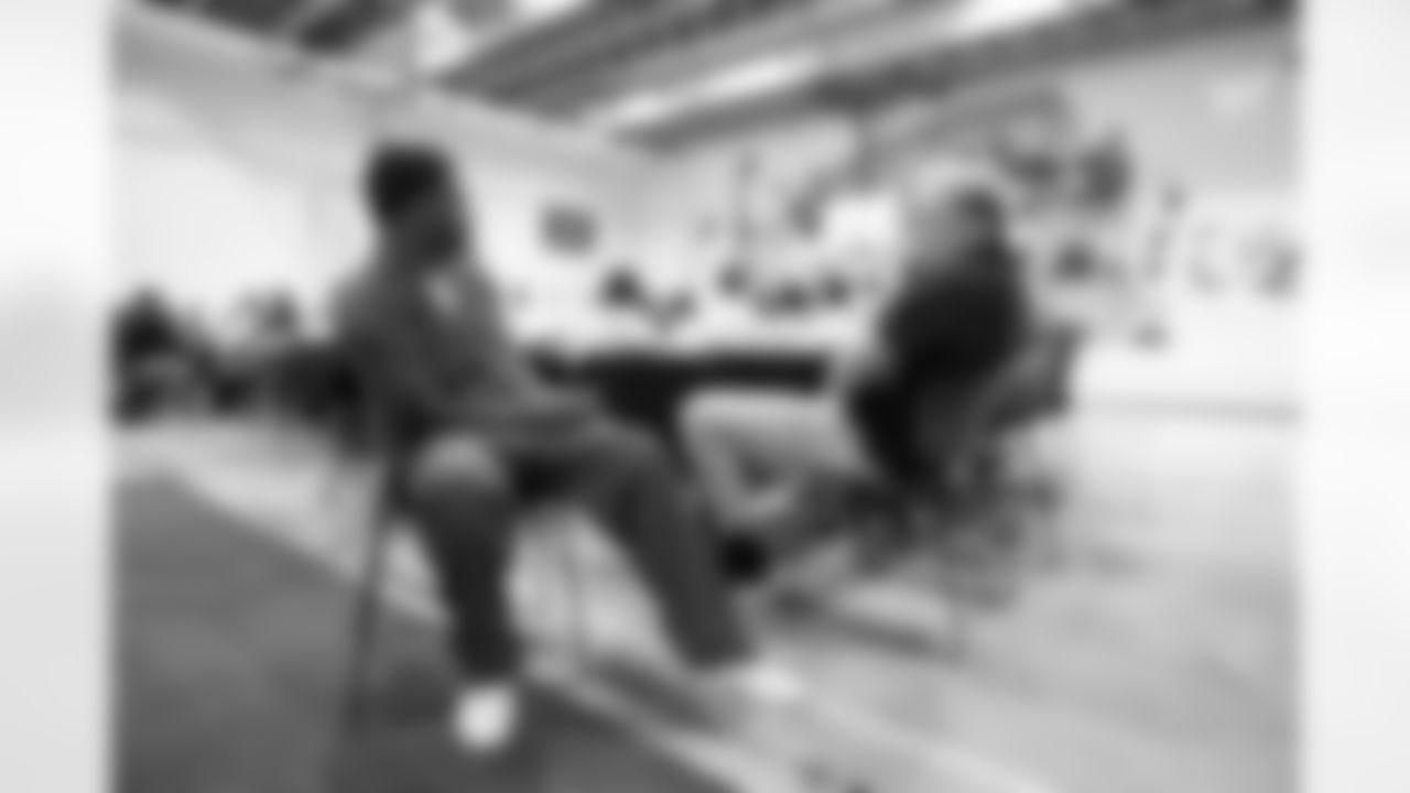 Garett Bolles talks with inmates at lunch during a visit to the Arkansas Valley Correctional Facility in Ordway, Colorado on October 14, 2025. In partnership with the Vera Institute of Justice, the Denver Broncos Foundation toured ChangeMakers Village (a Restoring Promise Unit).Photo by Gabriel Christus / Denver Broncos