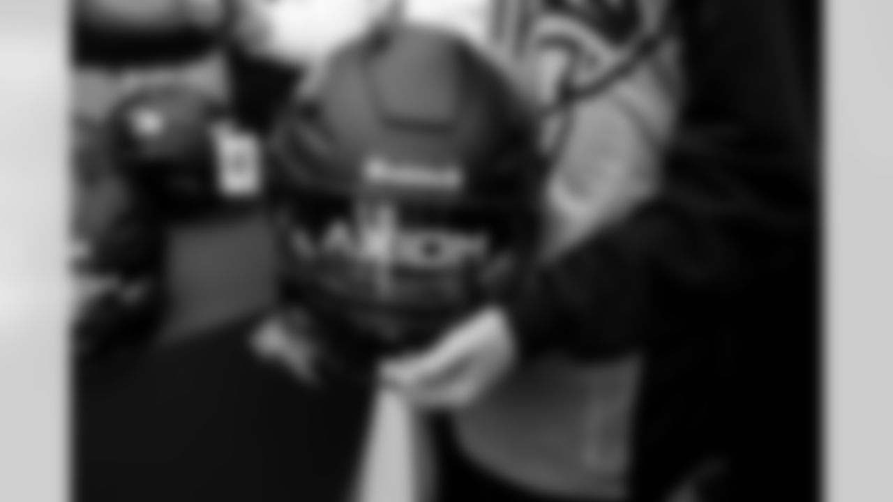 Leicester youth players react to their new helmets during the Leicester Panthers' visit to practice in Ware, England on October 10, 2025. Photo by Ben Swanson / Denver Broncos