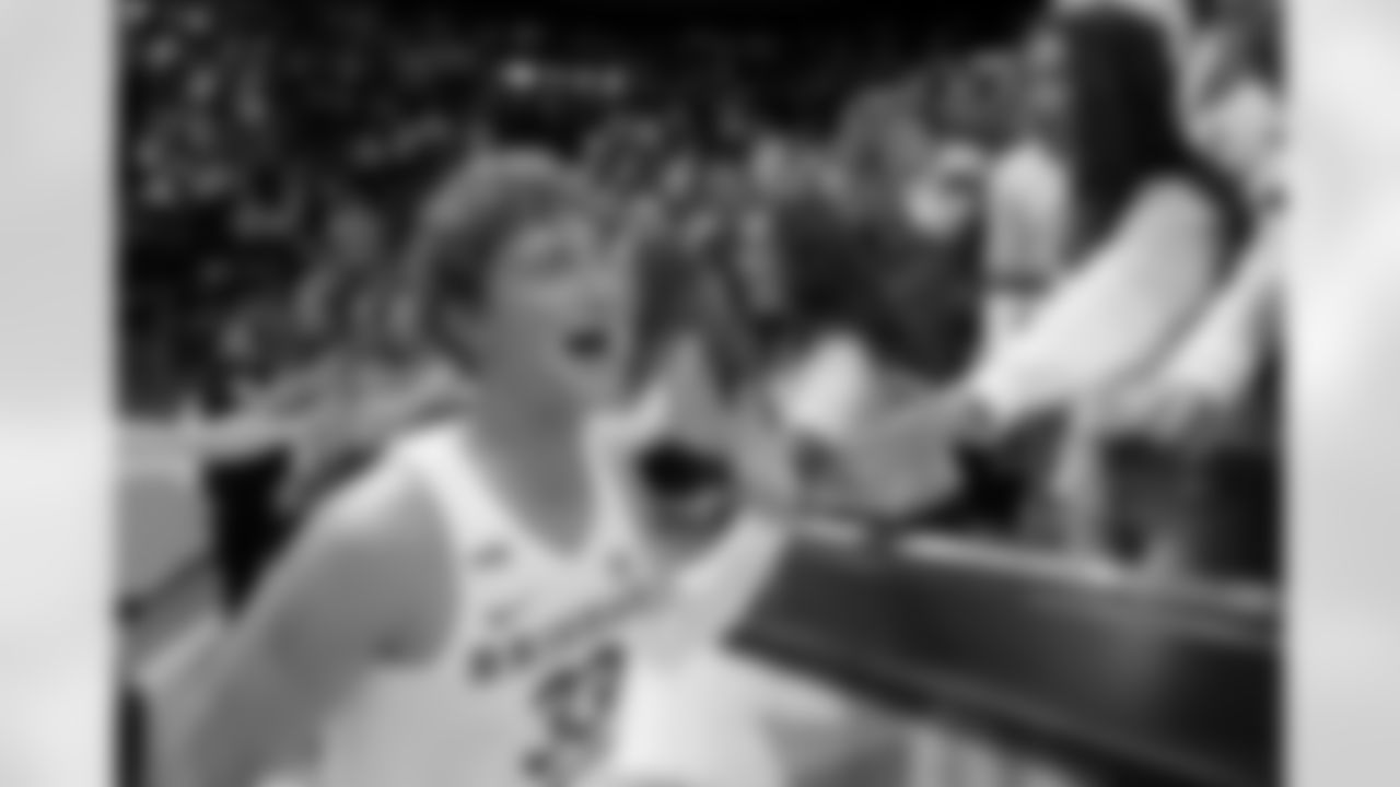 BYU forward Caleb Lohner (33) celebrates the team's victory over San Diego State in an NCAA college basketball game Friday, Nov. 12, 2021, in Provo, Utah. (AP Photo/Rick Bowmer)