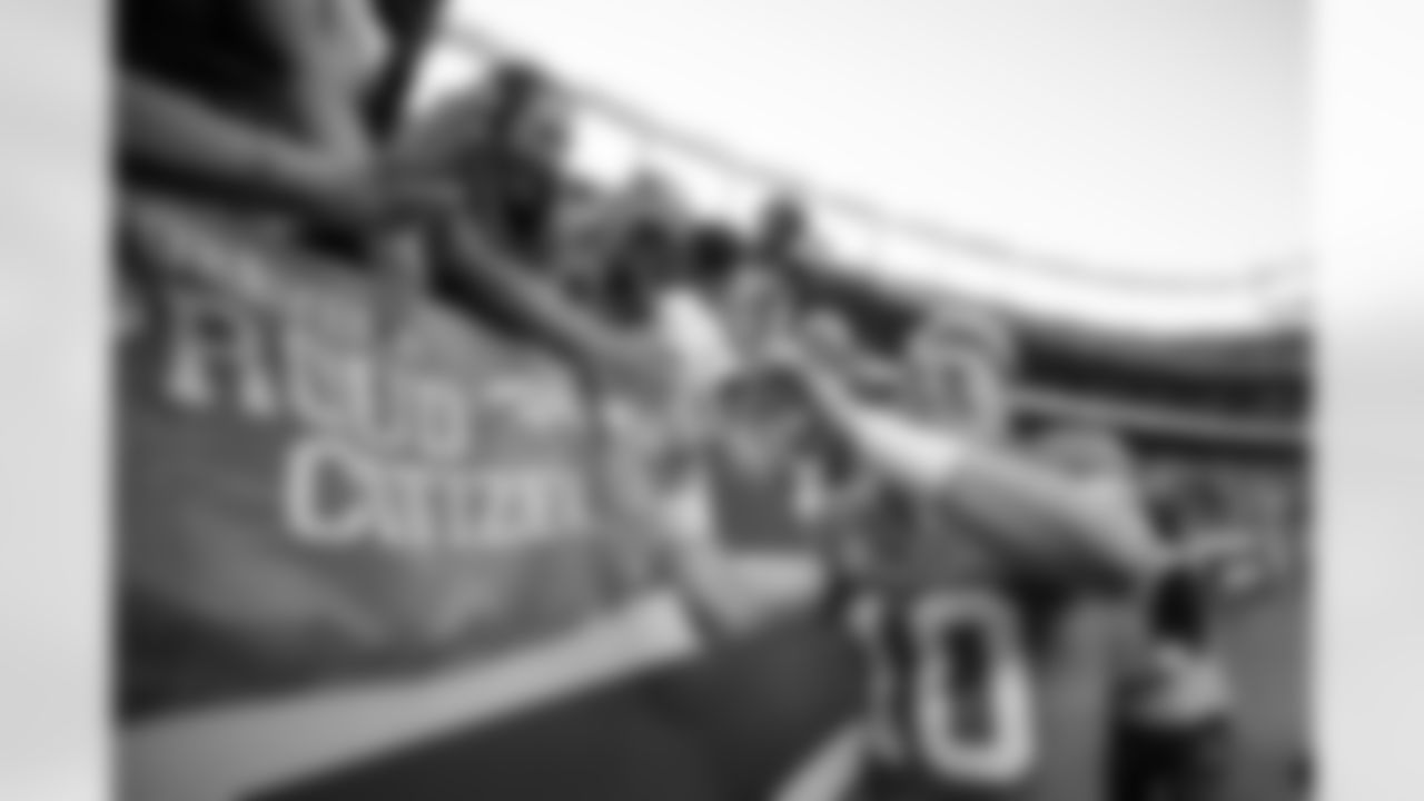 Denver Broncos quarterback Bo Nix (10) high-fives fans after the Broncos' Week 5 game against the Las Vegas Raiders at Empower Field at Mile High in Denver, Colorado on October 6, 2024. Photo by Ben Swanson / Denver Broncos