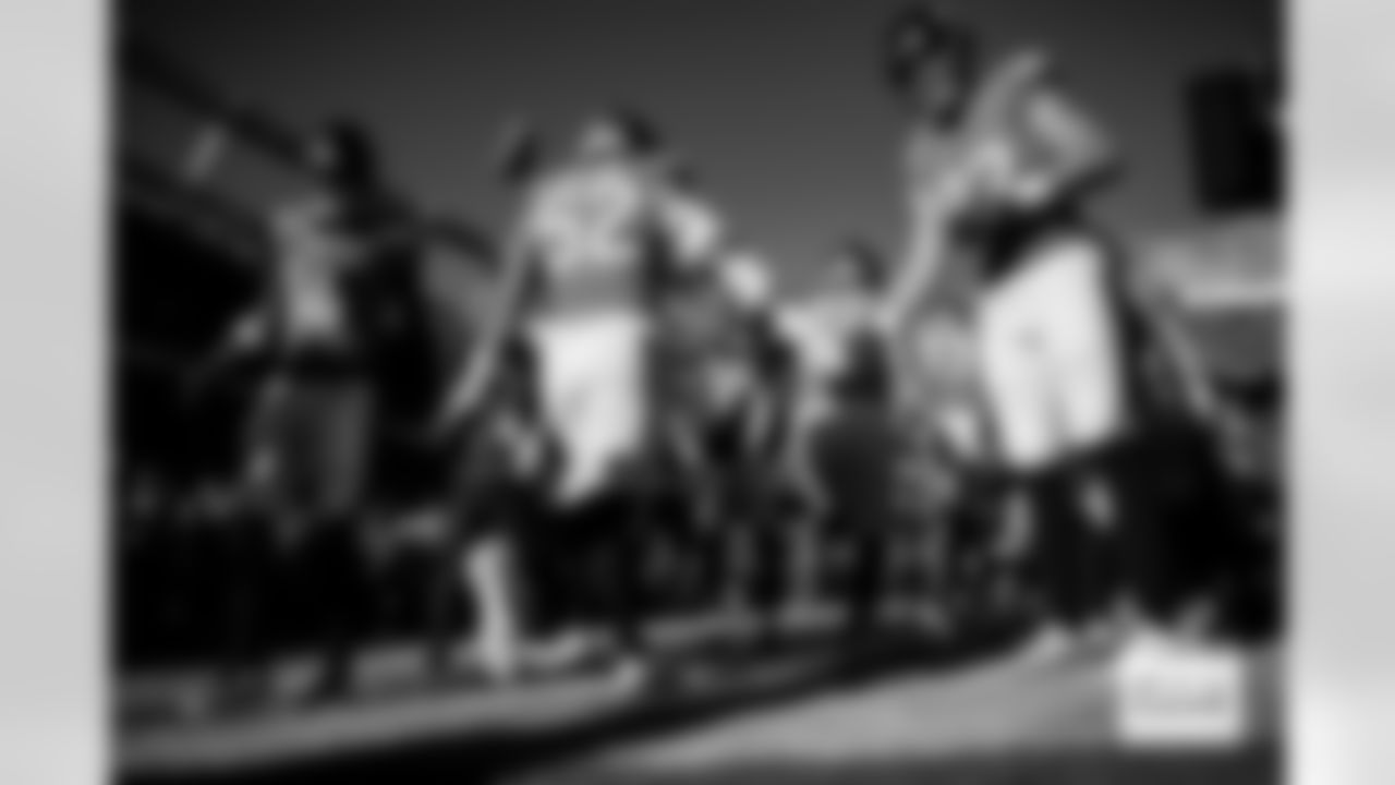 Denver Broncos wide receiver Courtland Sutton (14) and tight end Adam Trautman (82) welcomes linebacker Jonah Elliss (52) to the field before the Broncos' Week 15 game against the Green Bay Packers at Empower Field at Mile High in Denver, Colorado on December 14, 2025. Photo by Ben Swanson / Denver Broncos