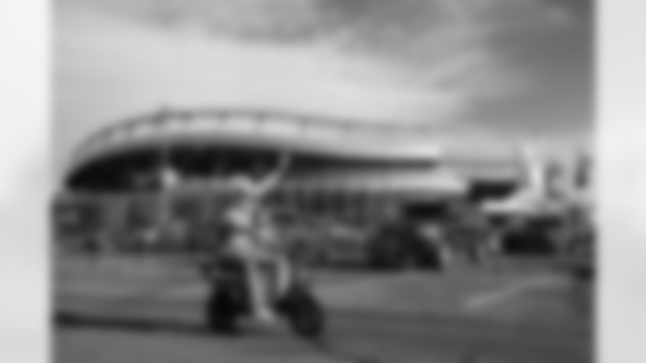 A fan rides a motorized bike before the Broncos' Week 18 game against the Los Angeles Chargers at Empower Field at Mile High in Denver, Colorado on January 4, 2026. Photo by Ben Swanson / Denver Broncos