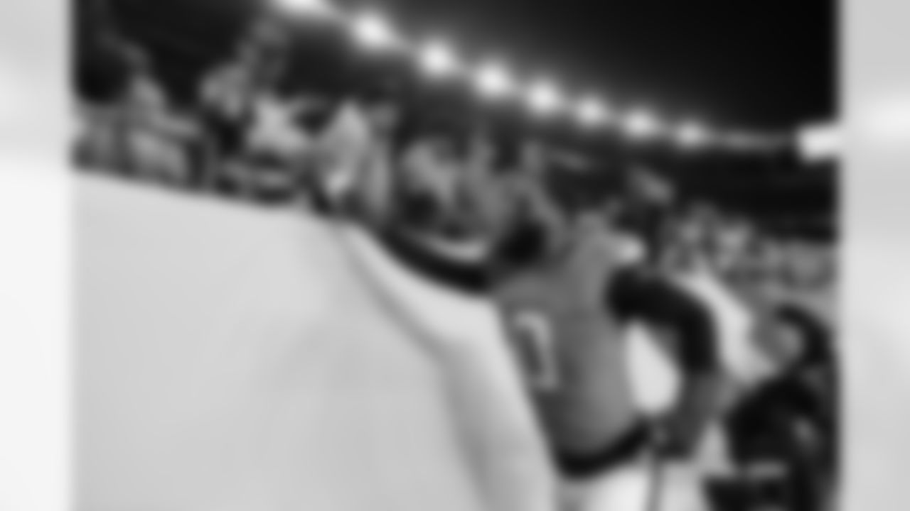 Denver Broncos linebacker Jonathon Cooper (0) high-fives fans after the Broncos' Week 15 game against the Green Bay Packers at Empower Field at Mile High in Denver, Colorado on December 14, 2025. Photo by Ben Swanson / Denver Broncos