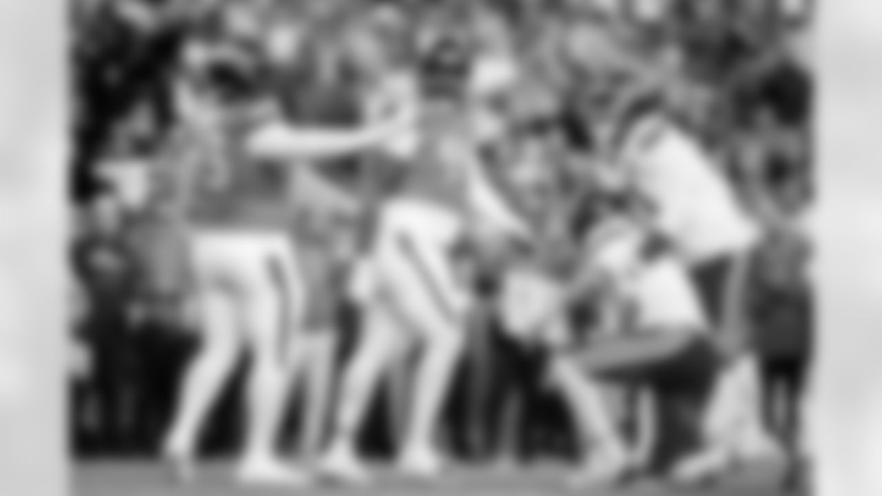 Denver Broncos defensive tackle D.J. Jones (93) reacts after a play as Kansas City Chiefs offensive tackle Josh Simmons (71) helps quarterback Patrick Mahomes (15) to his feet during the Broncos' Week 11 game against the Kansas City Chiefs at Empower Field at Mile High in Denver, Colorado on November 16, 2025. Photo by Ben Swanson / Denver Broncos