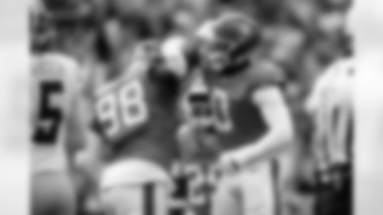 Denver Broncos defensive end John Franklin-Myers (98) celebrates with linebacker Jonathon Cooper (0) after a sack during the Broncos' Week 8 game against the Dallas Cowboys at Empower Field at Mile High in Denver, Colorado on October 26, 2025. Photo by Ben Swanson / Denver Broncos