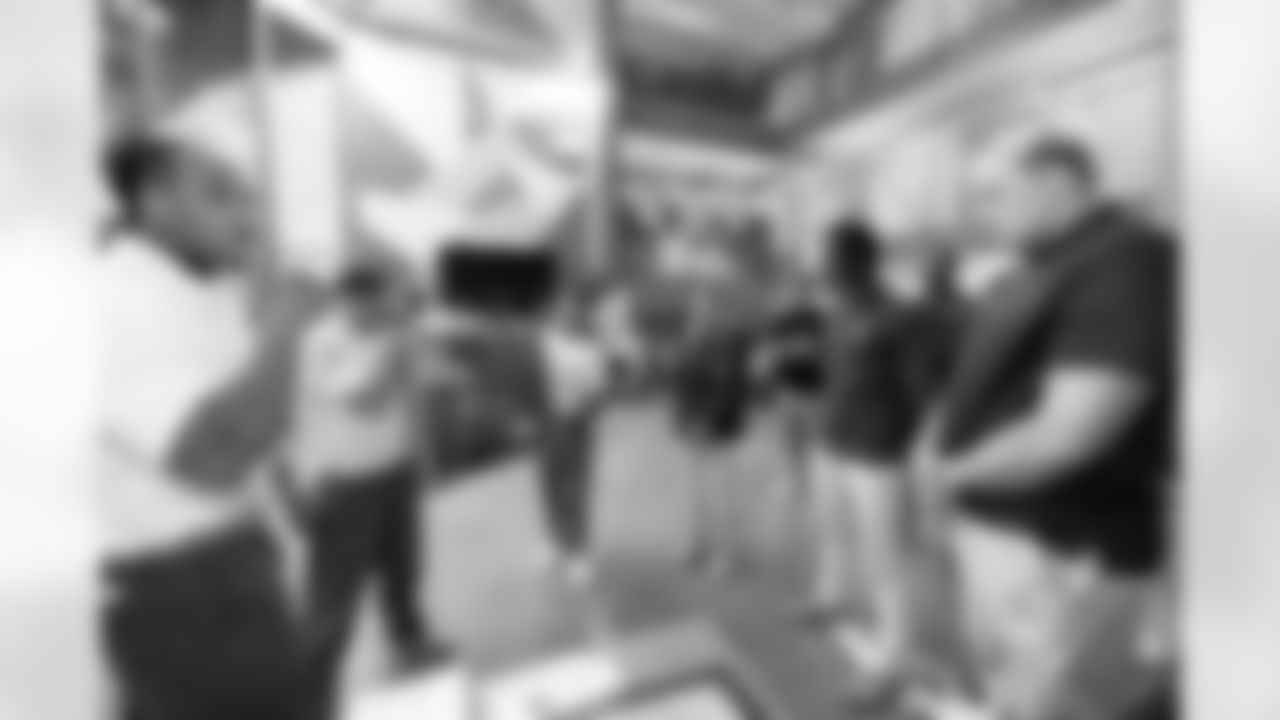 ChangeMakers give a gift to Carrie Walton Penner, Pat Bryant and Garett Bolles during a visit to the Arkansas Valley Correctional Facility in Ordway, Colorado on October 14, 2025. In partnership with the Vera Institute of Justice, the Denver Broncos Foundation toured ChangeMakers Village (a Restoring Promise Unit).Photo by Gabriel Christus / Denver Broncos