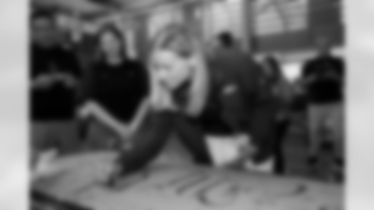 Carrie Walton Penner signs the ChangeMaker's sign during a visit to the Arkansas Valley Correctional Facility in Ordway, Colorado on October 14, 2025. In partnership with the Vera Institute of Justice, the Denver Broncos Foundation toured ChangeMakers Village (a Restoring Promise Unit).Photo by Gabriel Christus / Denver Broncos