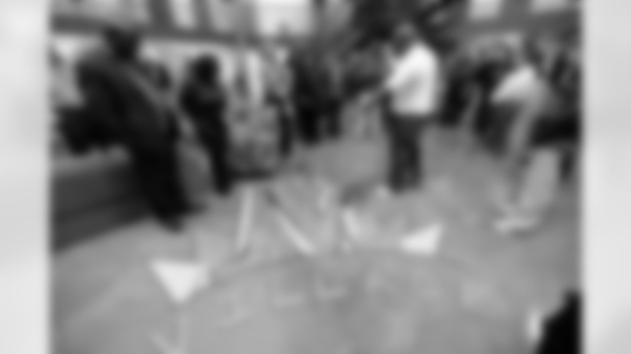 An inmate points out the ChangeMakers logo during a visit to the Arkansas Valley Correctional Facility in Ordway, Colorado on October 14, 2025. In partnership with the Vera Institute of Justice, the Denver Broncos Foundation toured ChangeMakers Village (a Restoring Promise Unit).Photo by Gabriel Christus / Denver Broncos