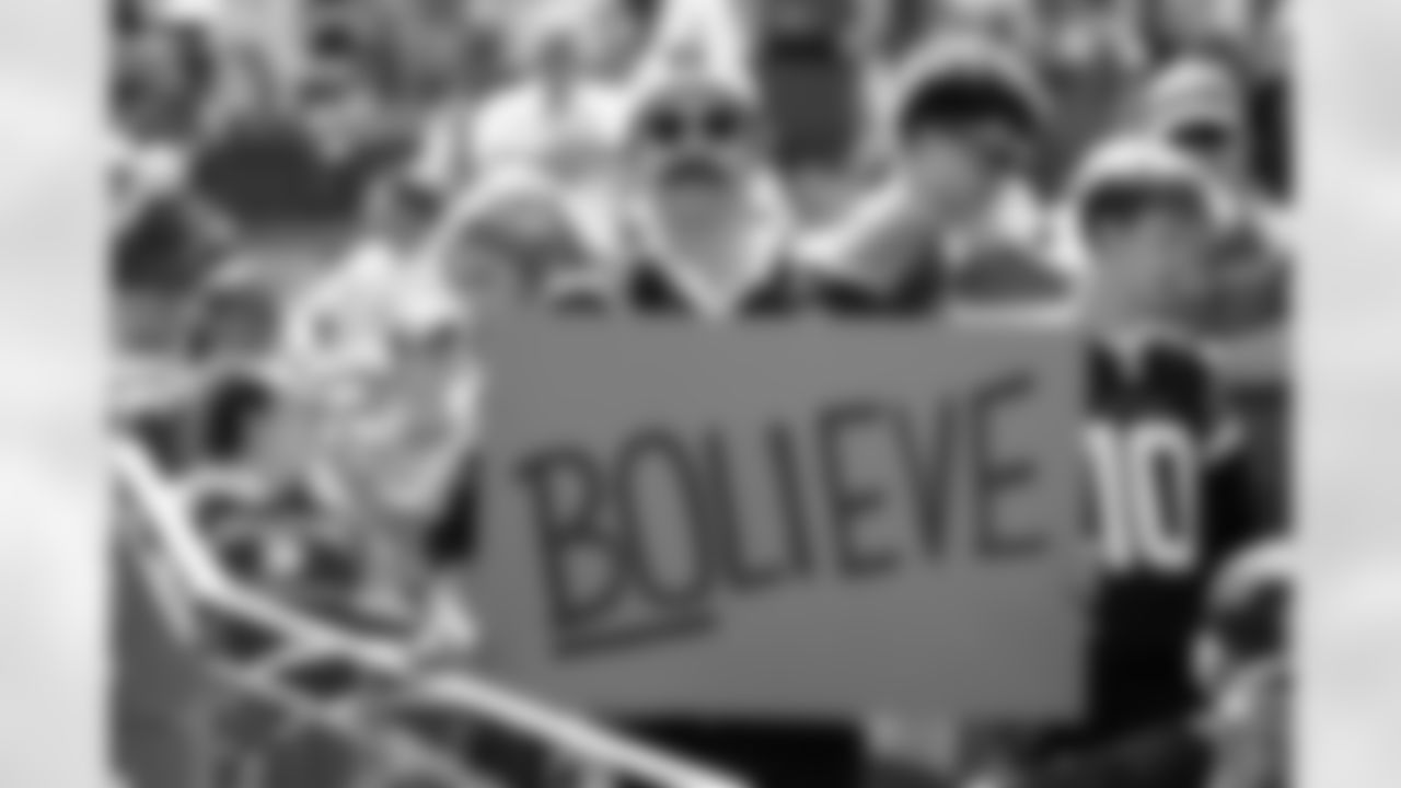 A fan dressed as Ted Lasso holds a "Bolieve" sign before the Broncos' Week 1 game against the Tennessee Titans at Empower Field at Mile High in Denver, Colorado on September 7, 2025. Photo by Ben Swanson / Denver Broncos
