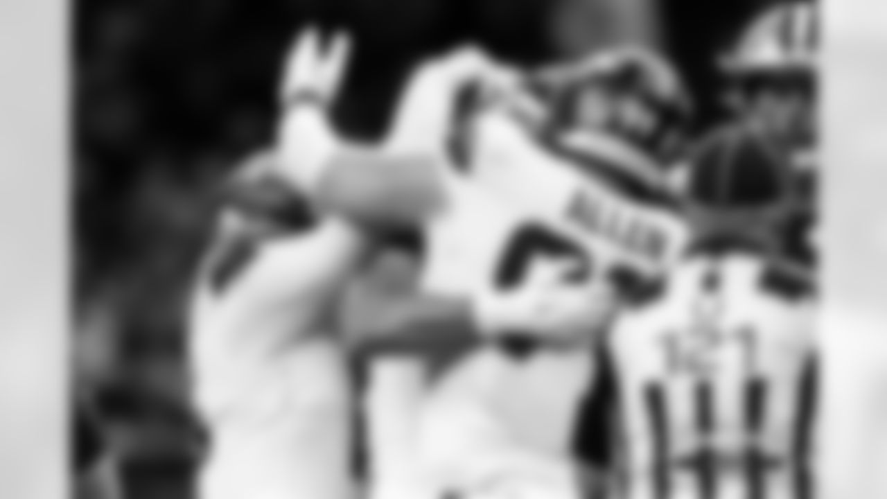 Zach Allen celebrates with teammates during the Broncos' Week 7 game against the New Orleans Saints at Caesars Superdome in New Orleans, Louisiana on October 17, 2024. Photo by Gabriel Christus / Denver Broncos
