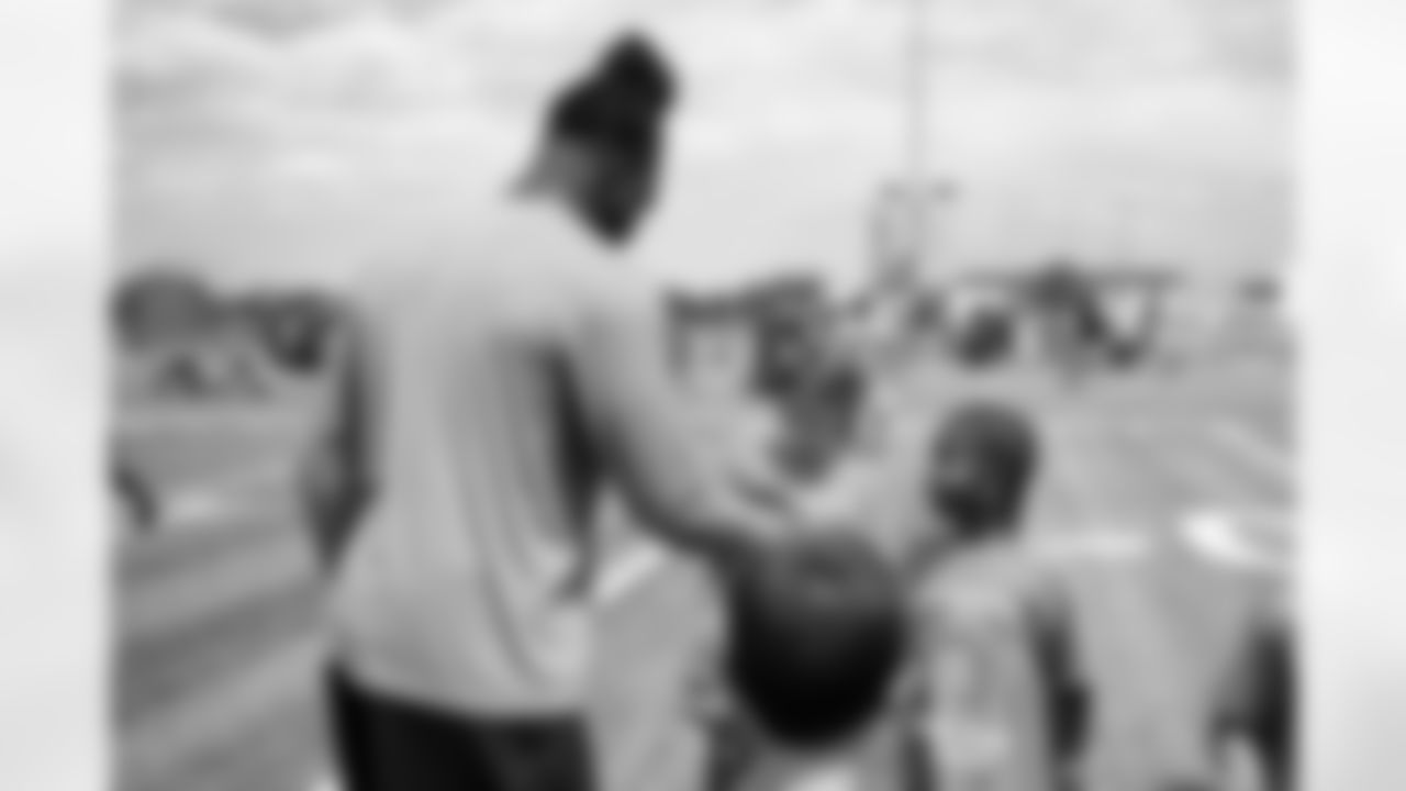 Johnny Walker Jr. helps out as Nik Bonitto holds a youth football camp at Columbine High School on July 20, 2025 in Littleton, Colorado. Photo by Ben Swanson / Denver Broncos