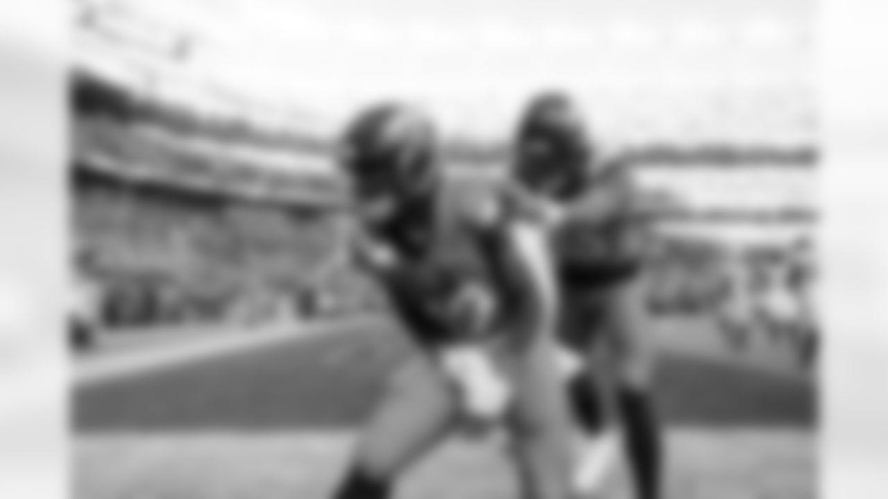 Denver Broncos running back RJ Harvey (12) celebrates a touchdown with wide receiver Pat Bryant (13) during the Broncos' Week 16 game against the Jacksonville Jaguars at Empower Field at Mile High in Denver, Colorado on December 21, 2025. Photo by Ben Swanson / Denver Broncos