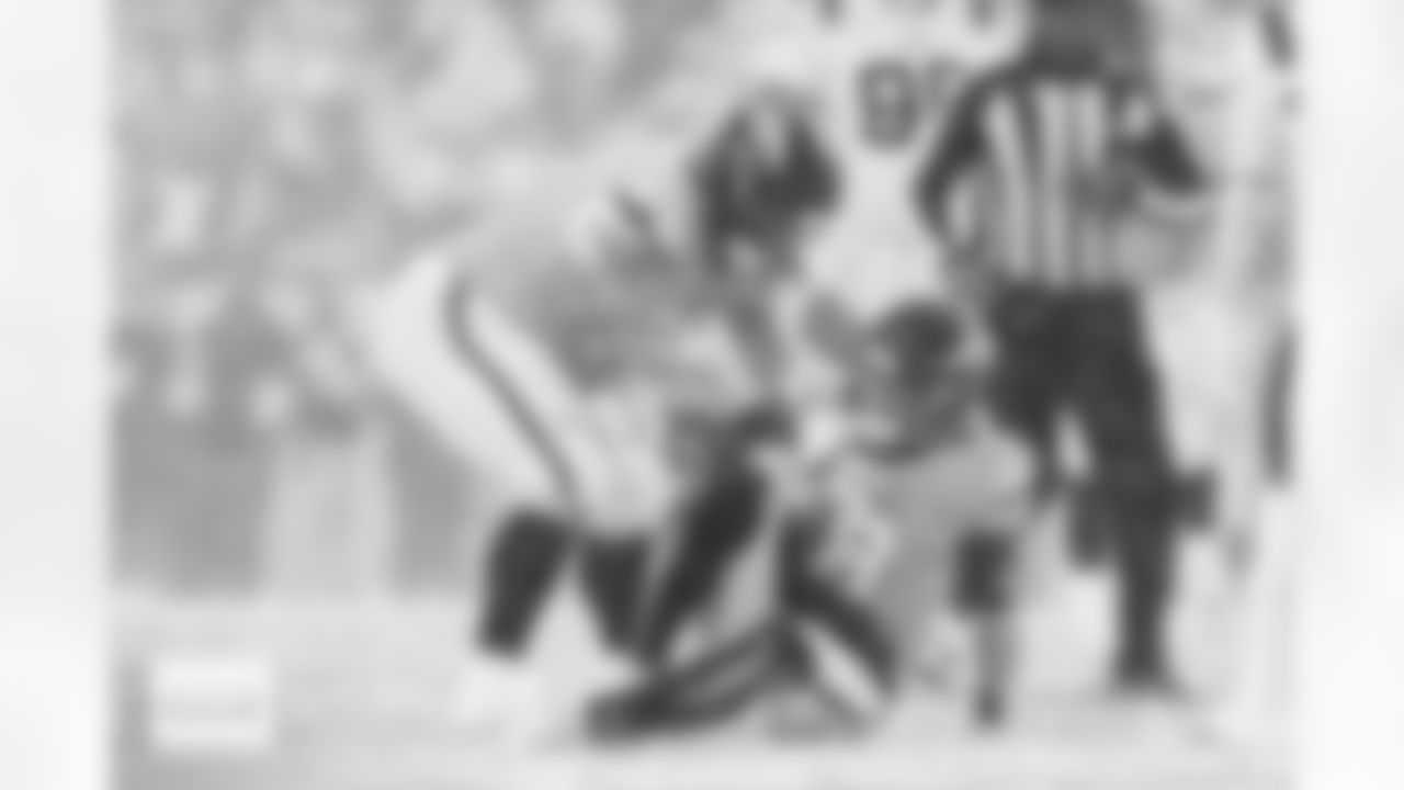 Denver Broncos guard Quinn Meinerz (77) helps up quarterback Jarrett Stidham (8) during the AFC Championship Game between the Denver Broncos and New England Patriots at Empower Field at Mile High in Denver, Colorado on January 25, 2026. Photo by Ben Swanson / Denver Broncos