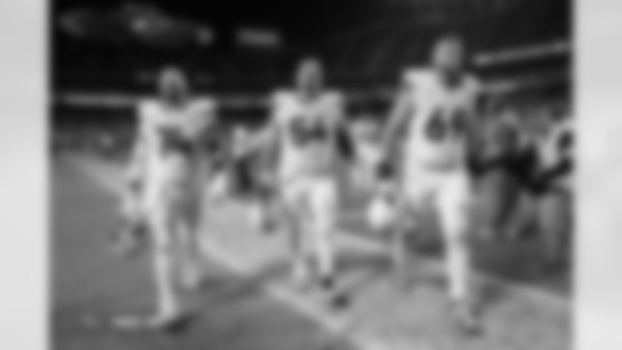 Ben Powers (74), Alex Forsyth (54) and Mike McGlinchey (69) after the Broncos' Week 17 game against the Kansas City Chiefs at GEHA Field at Arrowhead Stadium in Kansas City, Missouri on December 25, 2025. Photo by Gabriel Christus / Denver Broncos