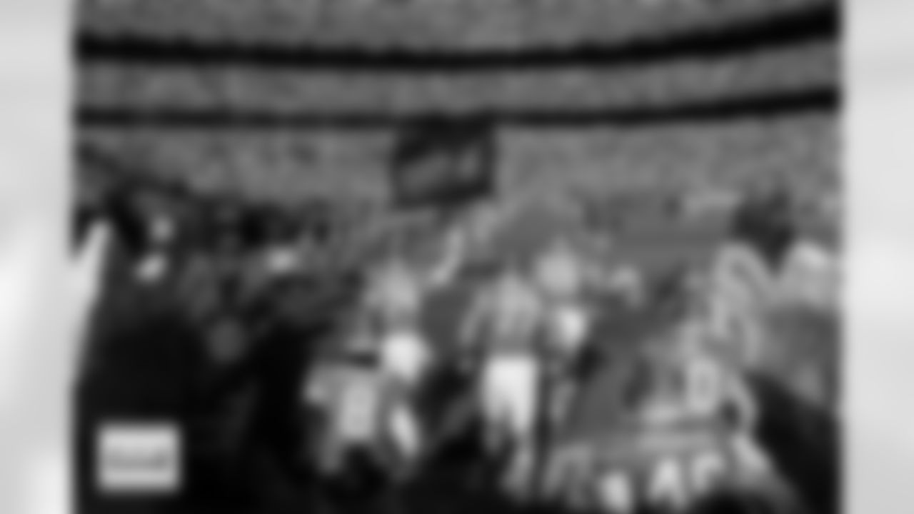 Players run out of the tunnel during player and team introductions before the Broncos' Week 18 game against the Los Angeles Chargers at Empower Field at Mile High in Denver, Colorado on January 4, 2026. Photo by Ben Swanson / Denver Broncos