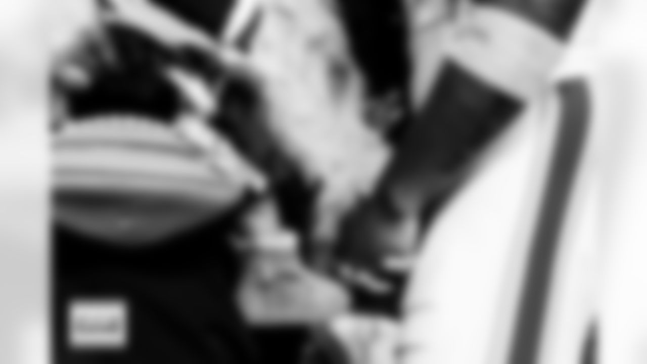 Denver Broncos wide receiver Trent Sherfield Sr. (5) says a prayer with his family before the Broncos' Week 10 game against the Las Vegas Raiders at Empower Field at Mile High in Denver, Colorado on November 6, 2025. Photo by Gavin Liddell / Denver Broncos