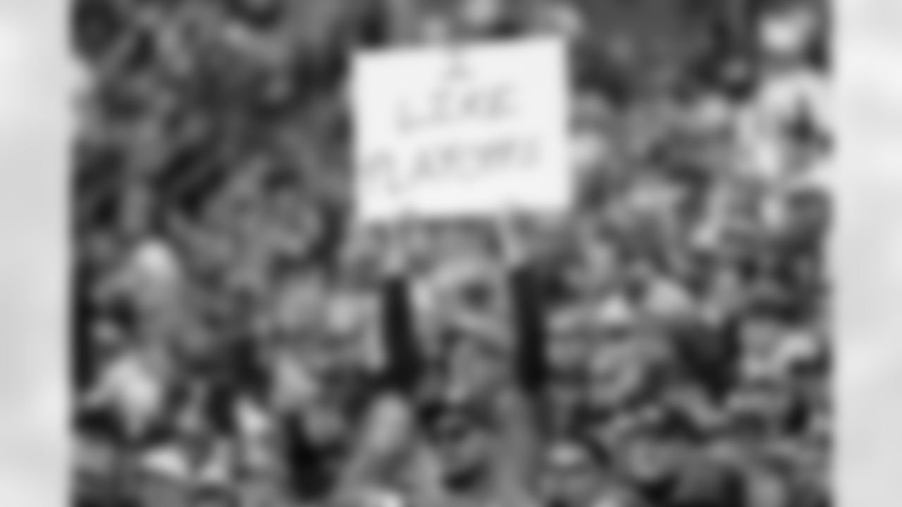 A fan holds a sign that says "I Like Playoffs" during the Broncos' Week 18 game against the Los Angeles Chargers at Empower Field at Mile High in Denver, Colorado on January 4, 2026. Photo by Ben Swanson / Denver Broncos