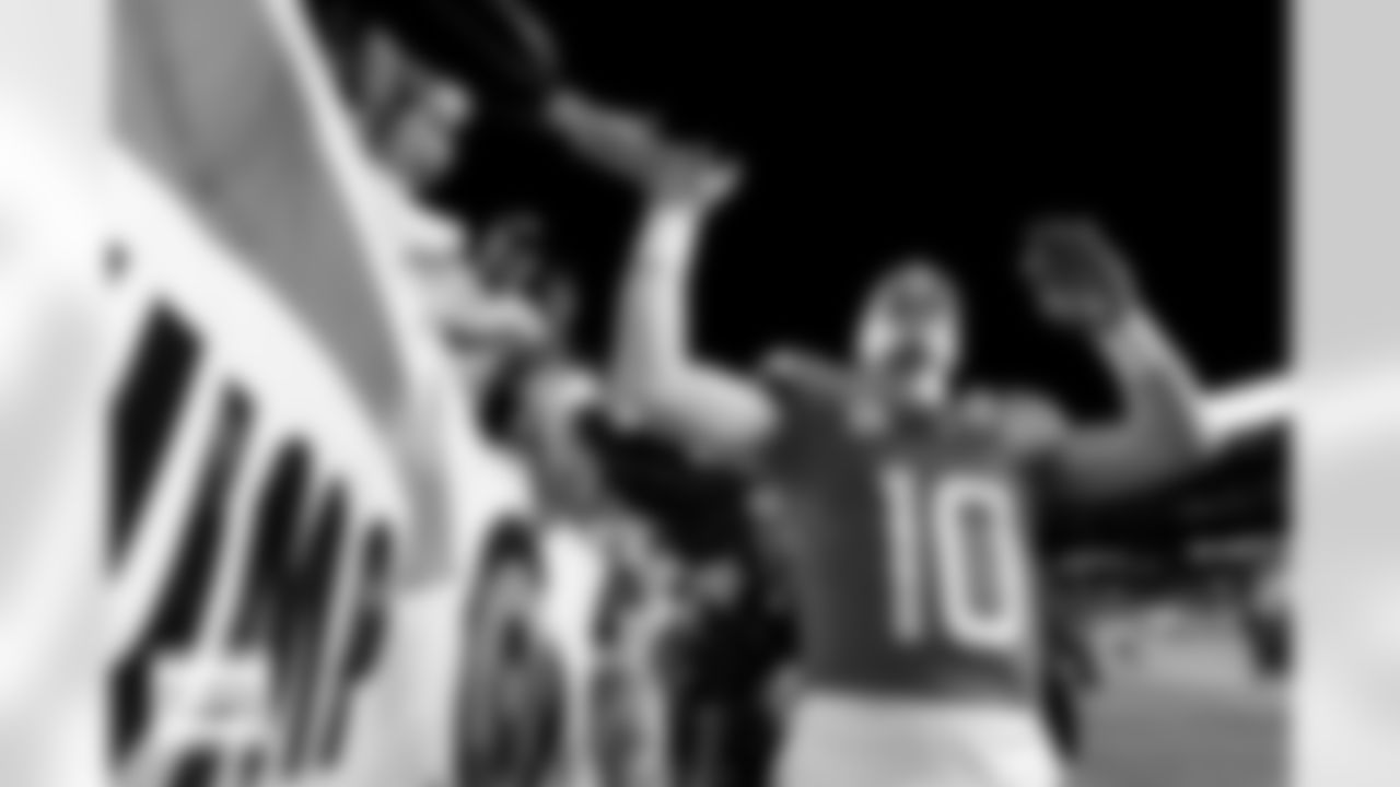 Denver Broncos quarterback Bo Nix (10) high-fives fans after the Broncos' Week 11 game against the Kansas City Chiefs at Empower Field at Mile High in Denver, Colorado on November 16, 2025. Photo by Gavin Liddell / Denver Broncos