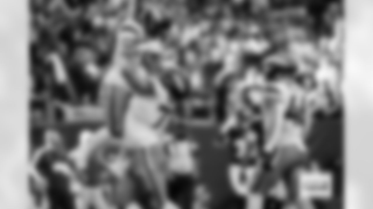 Denver Broncos guard Quinn Meinerz (77) lifts running back RJ Harvey (12) up after a touchdown during the Broncos' Week 9 game against the Houston Texans at NRG Stadium in Houston, Texas on November 2, 2025. Photo by Gabriel Christus / Denver Broncos