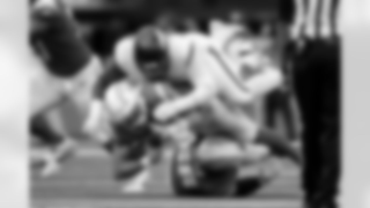 Denver Broncos defensive end John Franklin-Myers (98) sacks Los Angeles Chargers quarterback Justin Herbert (10) during the Broncos' Week 3 game against the Los Angeles Chargers at SoFi Stadium in Inglewood, California on September 21, 2025. Photo by Ben Swanson / Denver Broncos