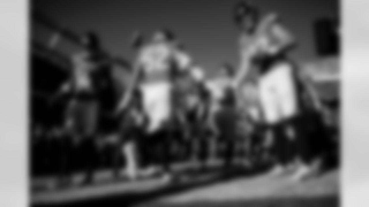 Denver Broncos wide receiver Courtland Sutton (14) and tight end Adam Trautman (82) welcomes linebacker Jonah Elliss (52) to the field before the Broncos' Week 15 game against the Green Bay Packers at Empower Field at Mile High in Denver, Colorado on December 14, 2025. Photo by Ben Swanson / Denver Broncos