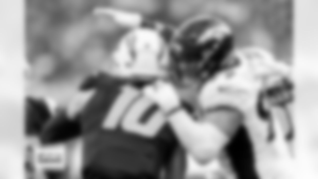 Denver Broncos defensive end Zach Allen (99) sacks Los Angeles Chargers quarterback Justin Herbert (10) during the Broncos' Week 14 game against the Los Angeles Chargers at SoFi Stadium in Inglewood, California on December 10, 2023. Photo by Gabriel Christus / Denver Broncos
