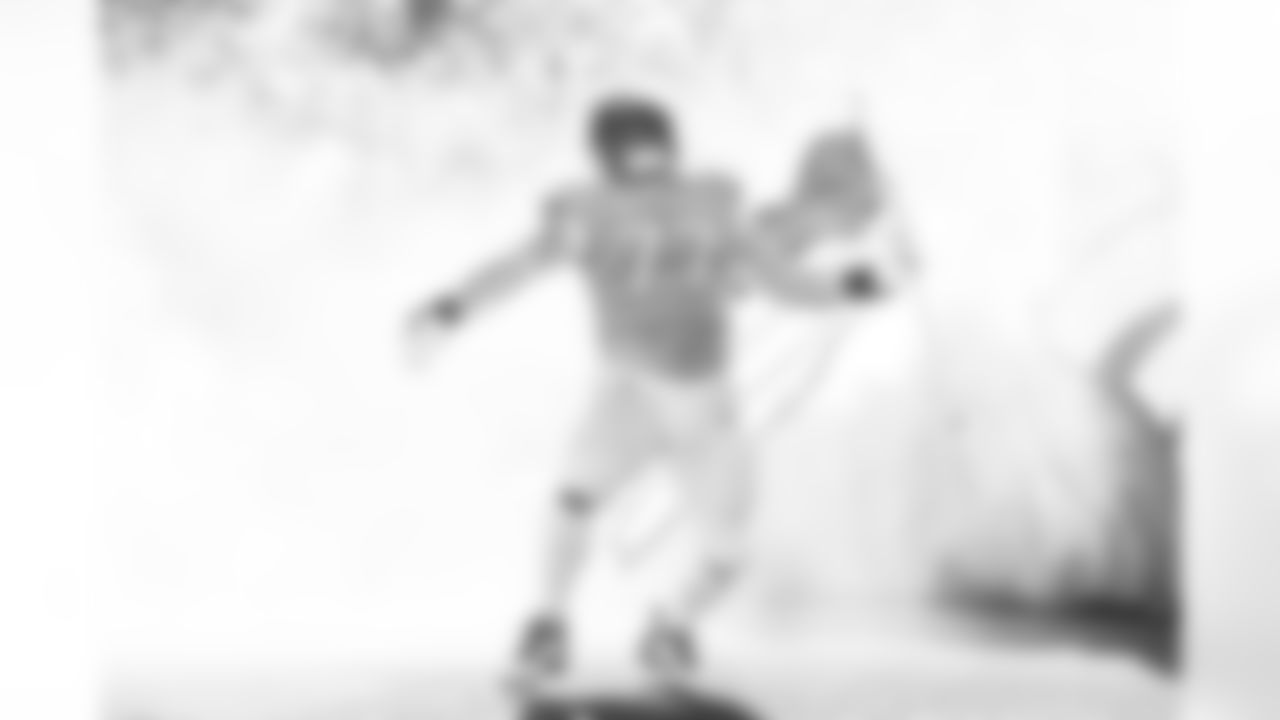 Denver Broncos guard Quinn Meinerz (77) runs out with an American flag during team and player introductions before the Broncos' Week 11 game against the Kansas City Chiefs at Empower Field at Mile High in Denver, Colorado on November 16, 2025. Photo by Ben Swanson / Denver Broncos