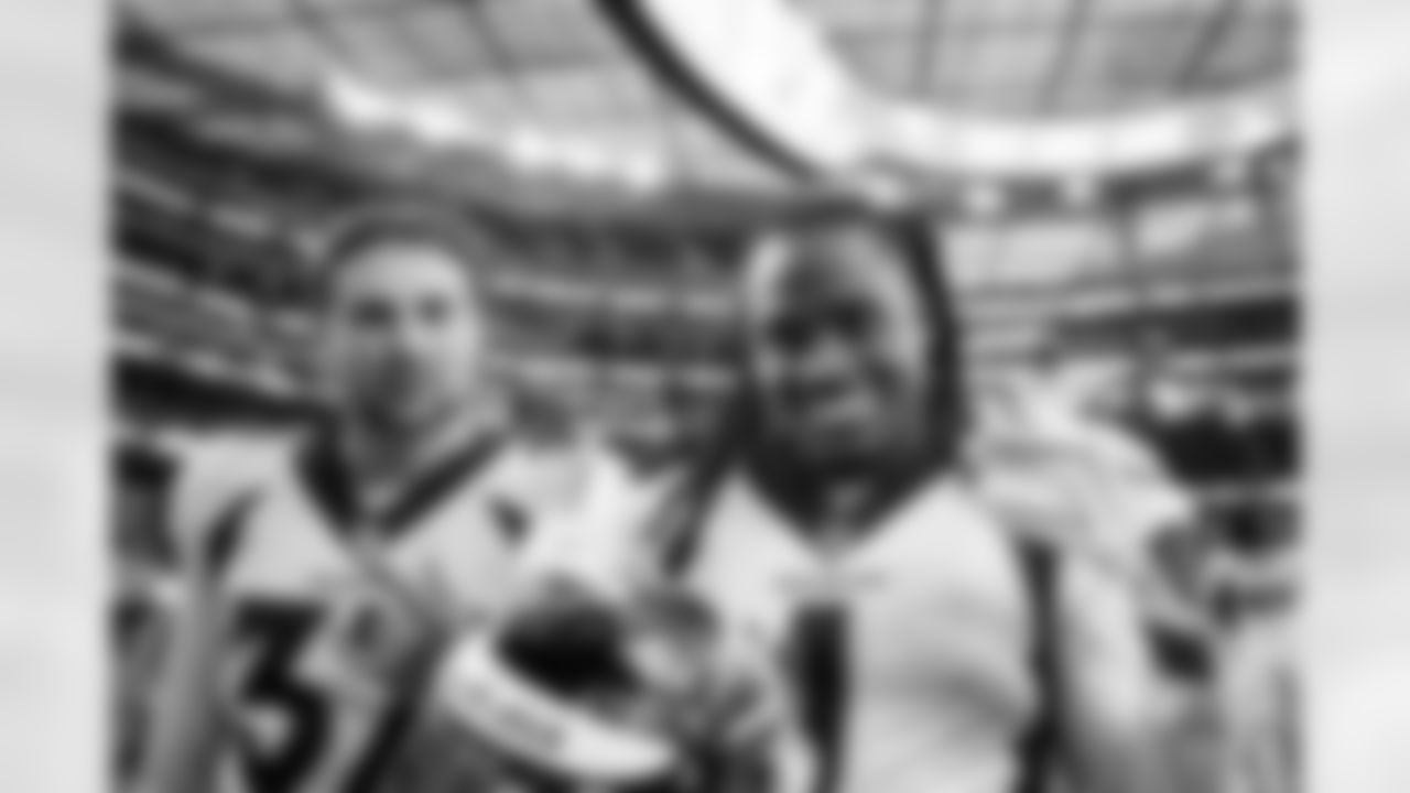 Denver Broncos cornerback Riley Moss (37) and cornerback Tremon Smith (1) react after the Broncos' Week 14 game against the Los Angeles Chargers at SoFi Stadium in Inglewood, California on December 10, 2023. Photo by Ben Swanson / Denver Broncos