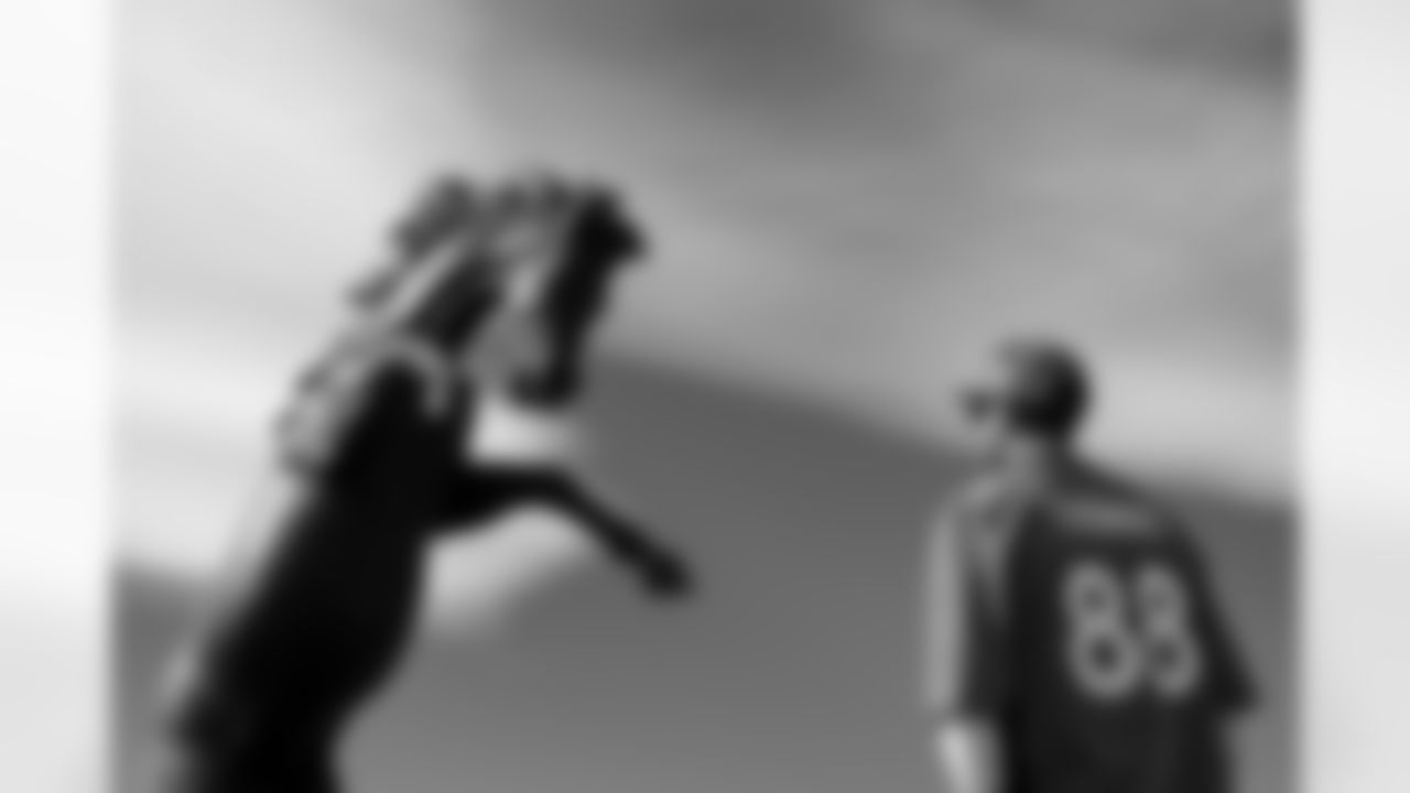 A fan in a Demaryius Thomas jersey stands in front of a horse sculpture before the Broncos' Week 7 game against the New York Giants at Empower Field at Mile High in Denver, Colorado on October 19, 2025. Photo by Ben Swanson / Denver Broncos