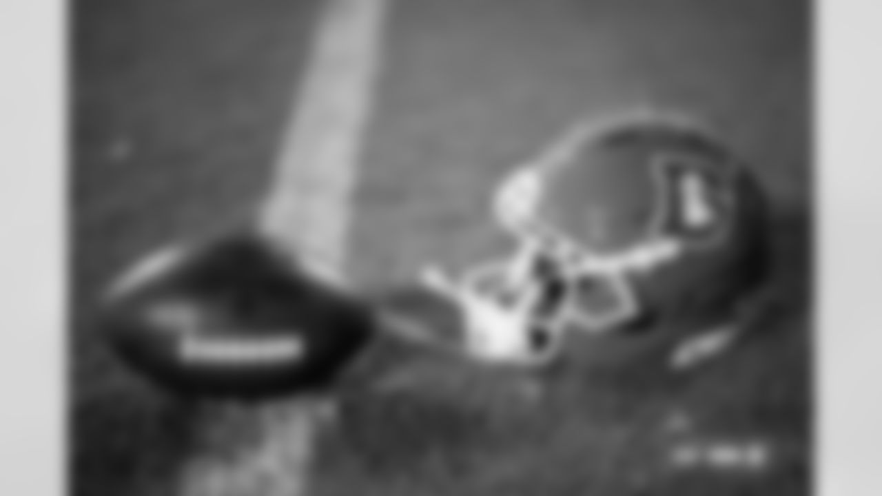 A Denver Broncos helmet and football photographed on film during the Broncos' Week 10 game against the Las Vegas Raiders at Empower Field at Mile High in Denver, Colorado on November 7, 2025. Photo by Gabriel Christus / Denver Broncos