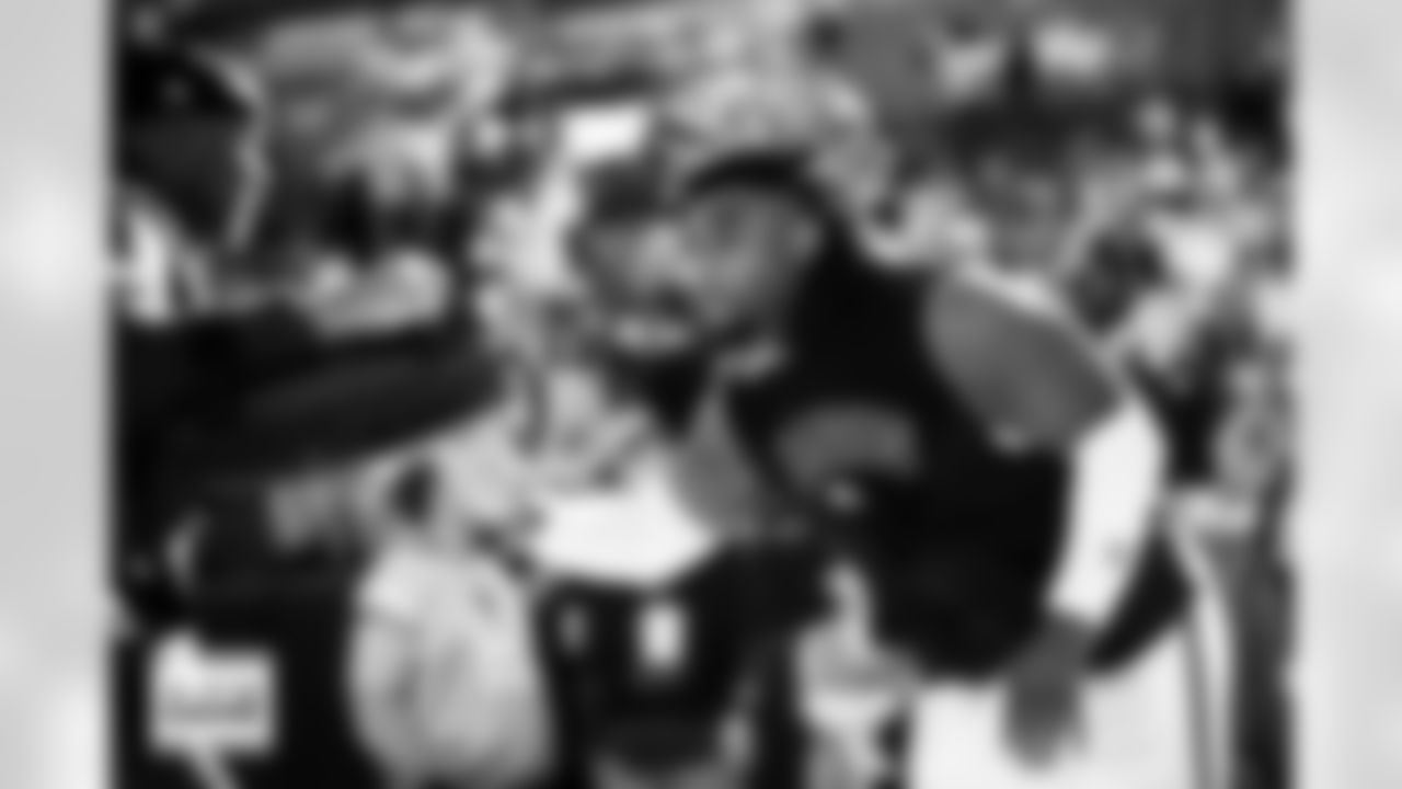 Malcolm Roach warms up before the Broncos' Week 15 game against the Green Bay Packers at Empower Field at Mile High in Denver, Colorado on December 14, 2025. Photo by Ben Swanson / Denver Broncos