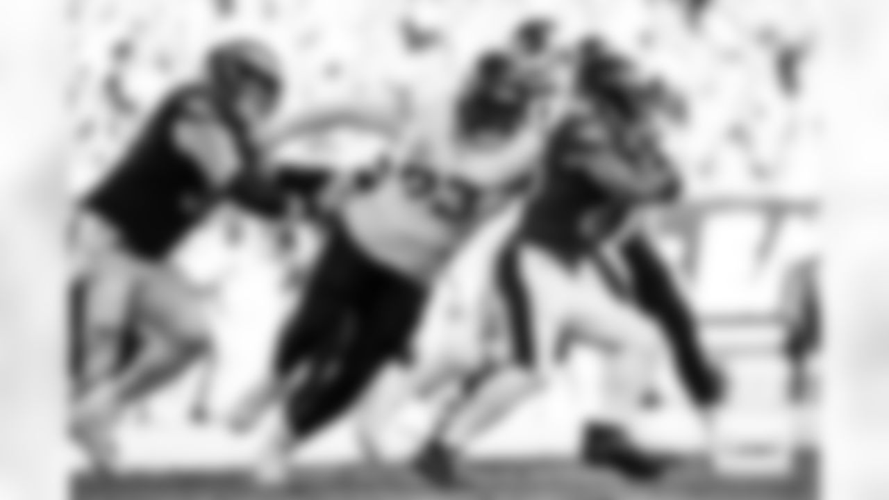 Denver Broncos defensive tackle D.J. Jones (93) tackles Philadelphia Eagles running back Saquon Barkley (26) during the Broncos' Week 5 game against the Philadelphia Eagles at Lincoln Financial Field in Philadelphia, Pennsylvania on October 5, 2025. Photo by Ben Swanson / Denver Broncos