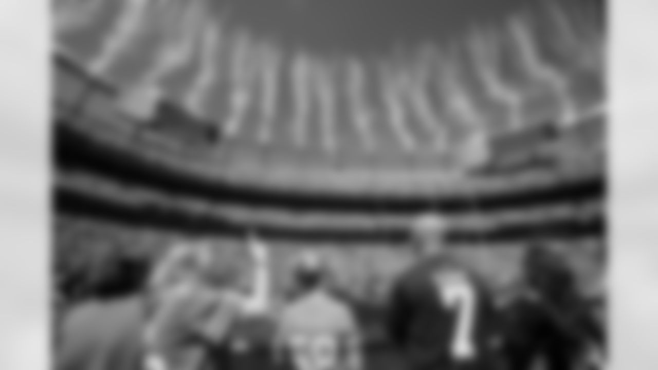 Fans hold the flag as fireworks go off during the national anthem before the Broncos' Week 1 game against the Tennessee Titans at Empower Field at Mile High in Denver, Colorado on September 7, 2025. Photo by Ben Swanson / Denver Broncos