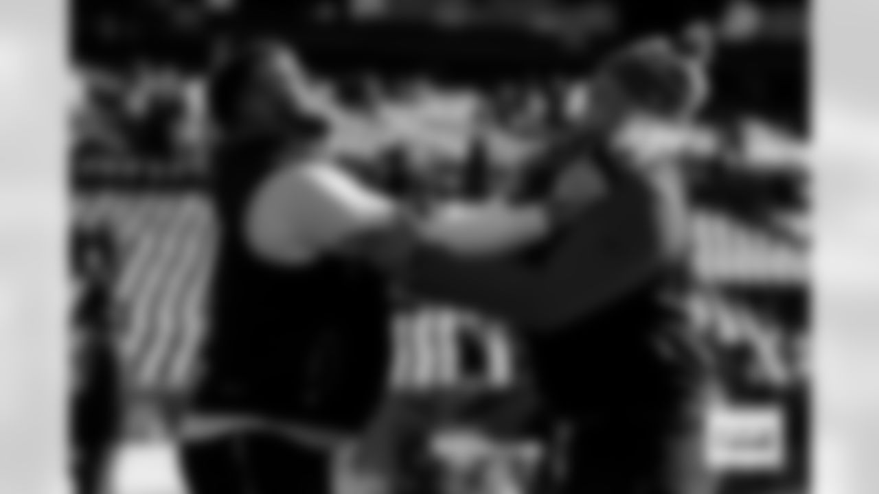 Mike McGlinchey warms up with Frank Crum before the Broncos' Divisional Round playoff game against the Buffalo Bills at Empower Field at Mile High in Denver, Colorado on January 17, 2026. Photo by Ben Swanson / Denver Broncos