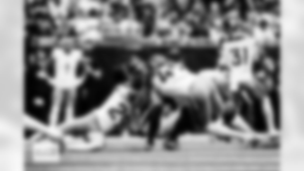 Denver Broncos cornerback Ja'Quan McMillian (29) and linebacker Alex Singleton (49) break up a pass during the Broncos' Week 9 game against the Houston Texans at NRG Stadium in Houston, Texas on November 2, 2025. Photo by Ben Swanson / Denver Broncos