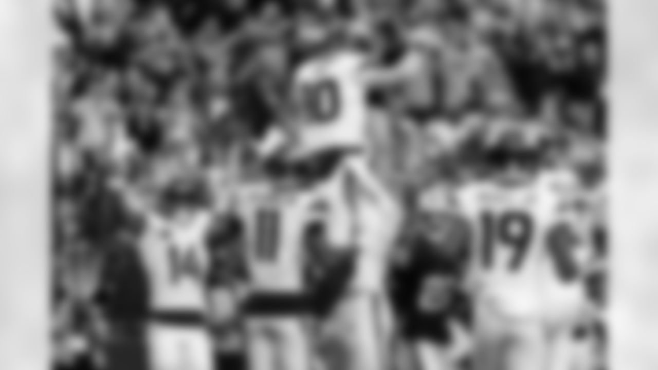 Denver Broncos quarterback Bo Nix (10) is lifted up by guard Quinn Meinerz (77) after a touchdown during the Broncos' Week 14 game against the Las Vegas Raiders at Allegiant Stadium in Las Vegas, Nevada on December 7, 2025. Photo by Ben Swanson / Denver Broncos