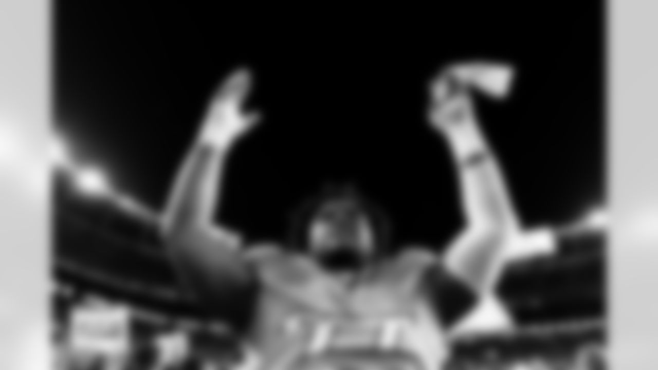 Denver Broncos defensive tackle Malcolm Roach (97) celebrates after the Broncos' Week 15 game against the Green Bay Packers at Empower Field at Mile High in Denver, Colorado on December 14, 2025. Photo by Ben Swanson / Denver Broncos