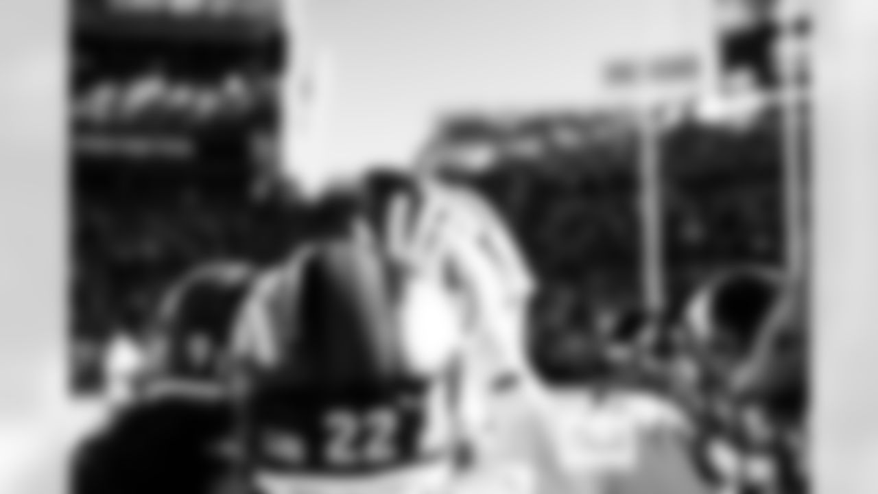 The Denver Broncos defensive backs hold a ball up in a huddle before the Broncos' Week 11 game against the Kansas City Chiefs at Empower Field at Mile High in Denver, Colorado on November 16, 2025. Photo by Gabriel Christus / Denver Broncos