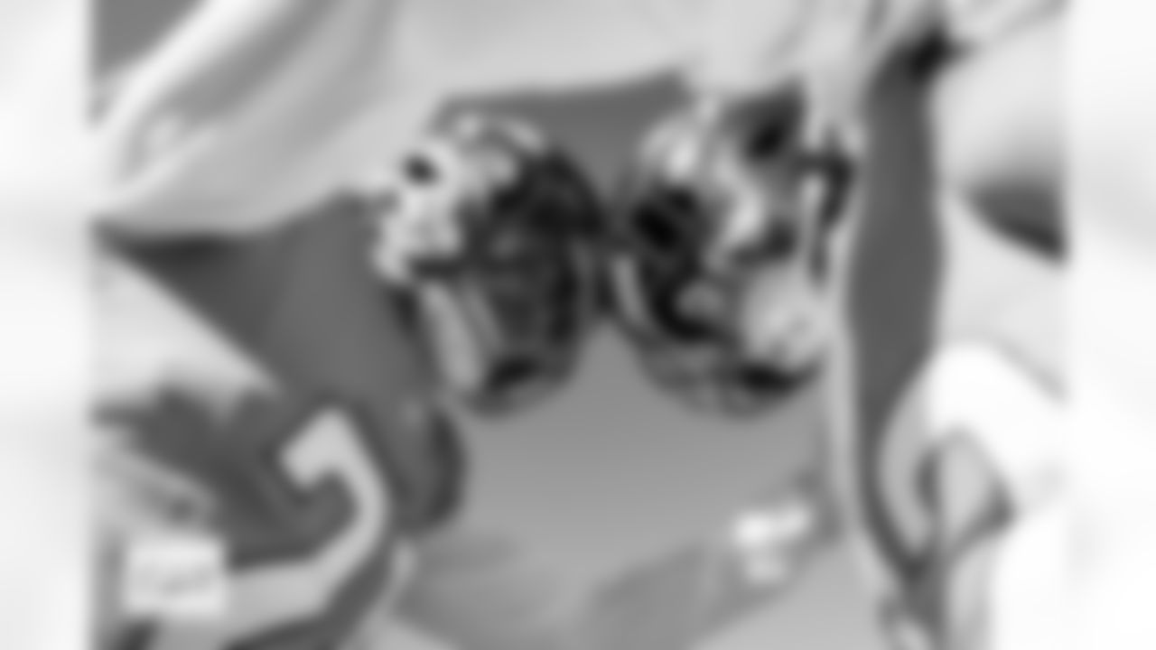 Denver Broncos cornerback Riley Moss (21) and safety Brandon Jones (22) share a moment before the Broncos' Week 11 game against the Kansas City Chiefs at Empower Field at Mile High in Denver, Colorado on November 16, 2025. Photo by Gabriel Christus / Denver Broncos