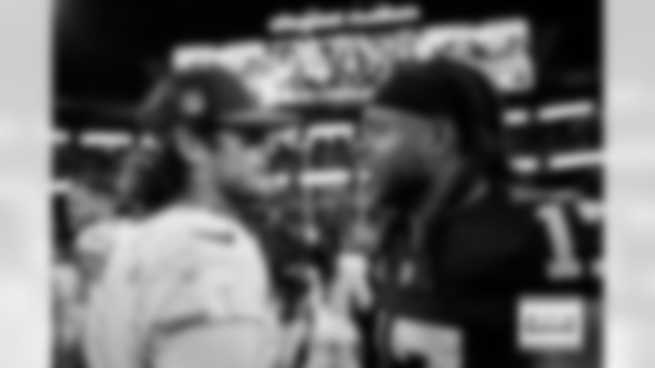 Denver Broncos quarterback Jarrett Stidham (4) greets Las Vegas Raiders wide receiver Davante Adams (17) after the Broncos' Week 18 game against the Las Vegas Raiders at Allegiant Stadium in Las Vegas, Nevada on January 7, 2024. Photo by Ben Swanson / Denver Broncos