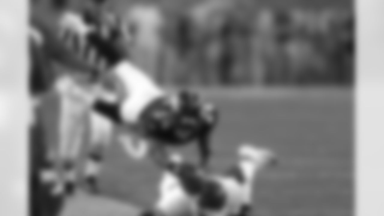 Champ Bailey dives for a first down on a reception against the Kansas City Chiefs during his first game as a Bronco on September 12, 2004 at Invesco Field at Mile High in Denver, Colorado.